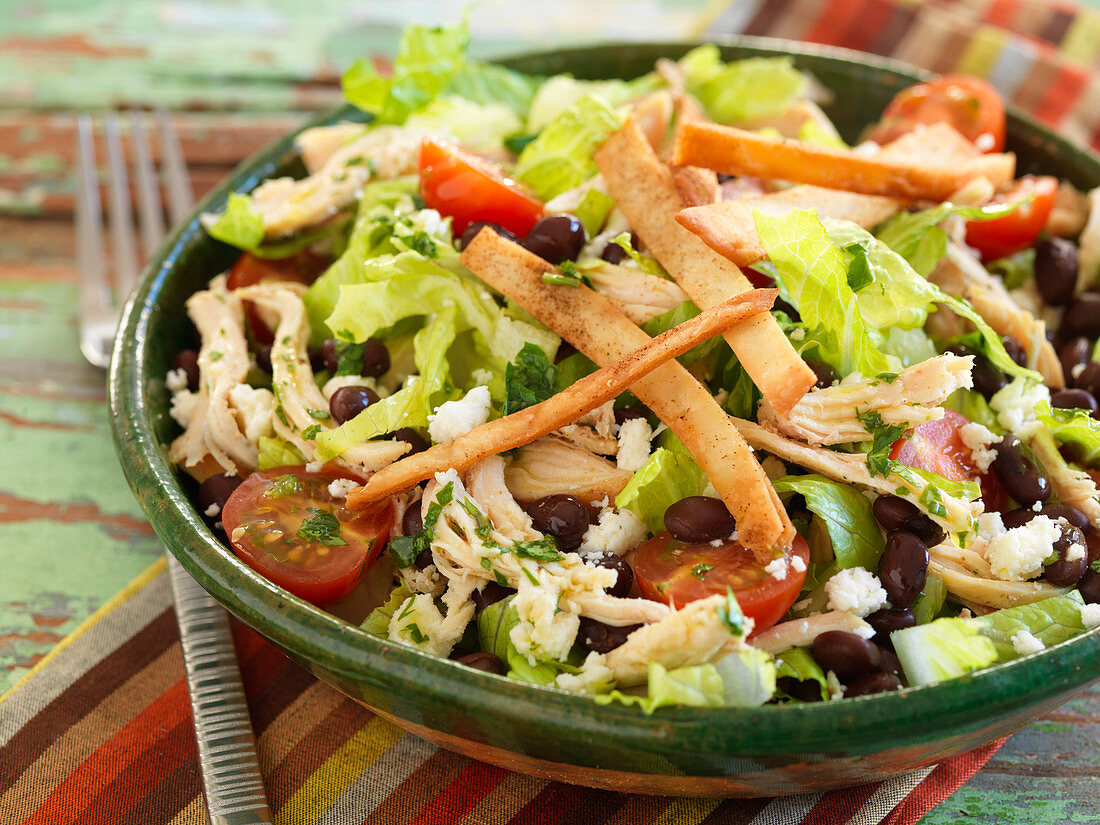 Tortilla salad with chicken and tomatoes