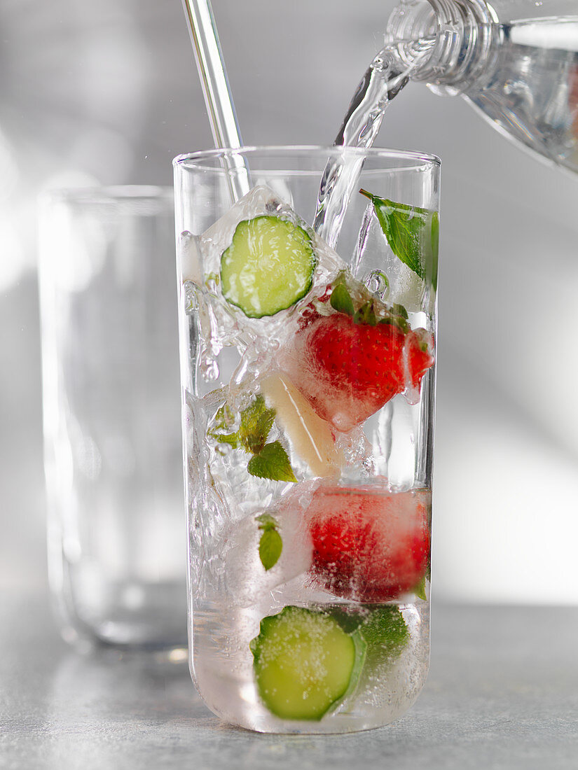 Water with cucumber and strawberries