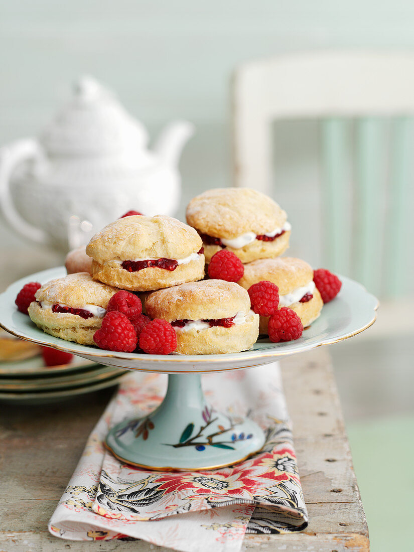 Lemon scones with raspberries, served with tea