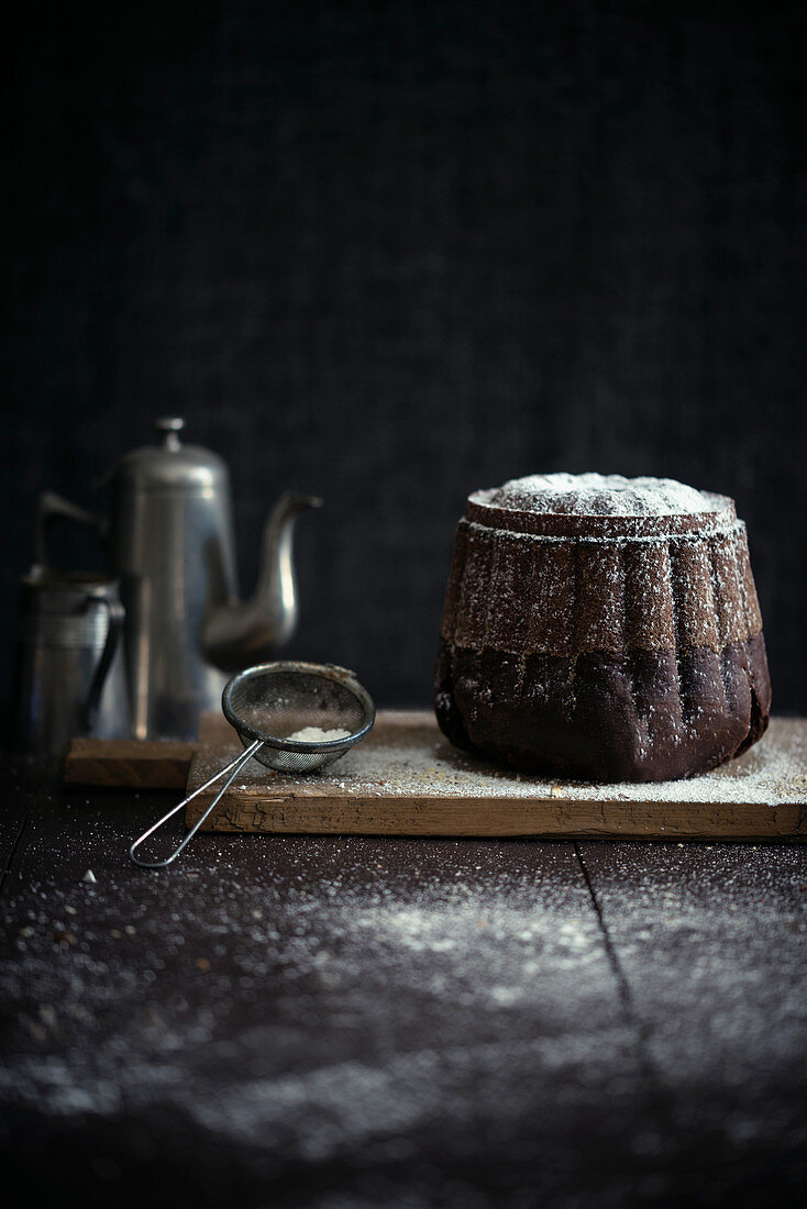 A vegan chocolate Bundt cake with icing sugar