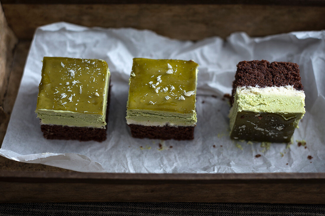 Vegan chocolate cake with tonka bean cream, matche cream and matcha jelly