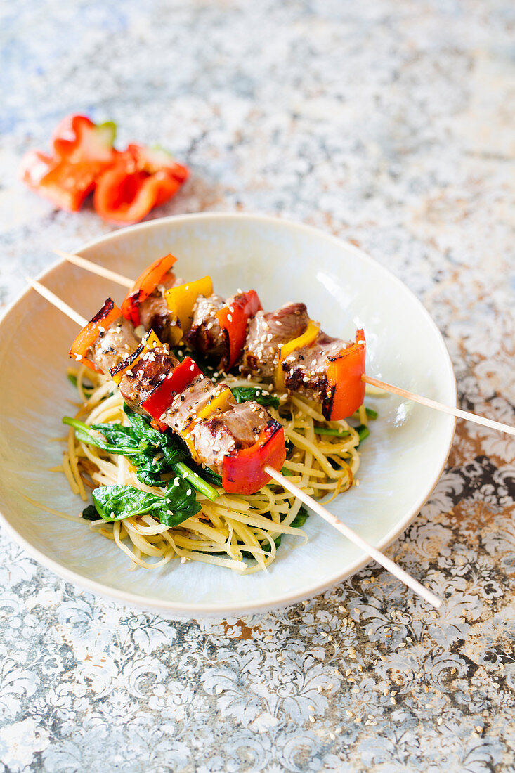 Parsnip noodles with spinach and lamb kebabs