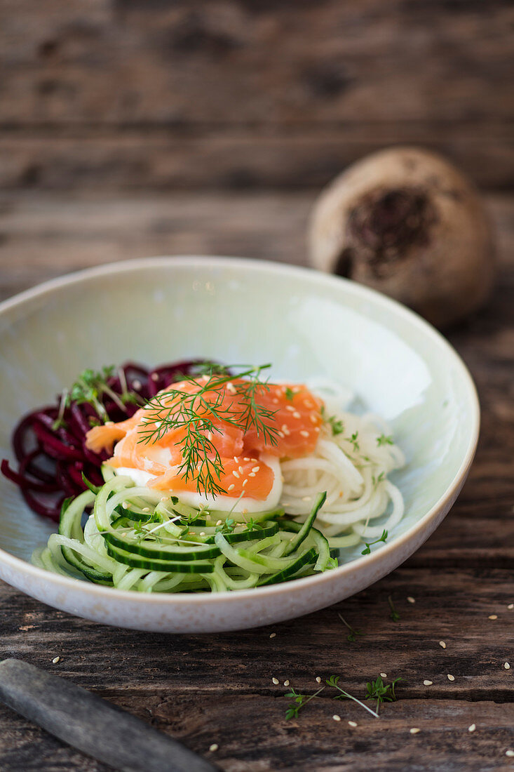A beetroot, radish and cucumber noodle salad with smoked salmon