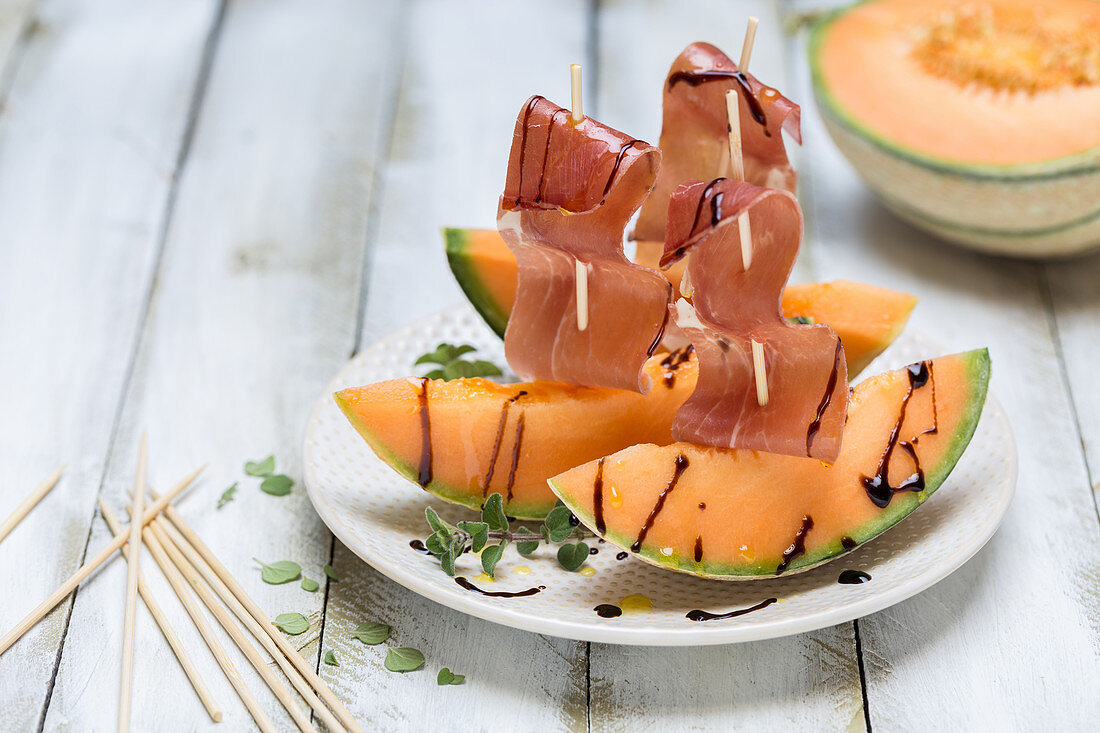 Serrano ham on melon with balsamic sauce