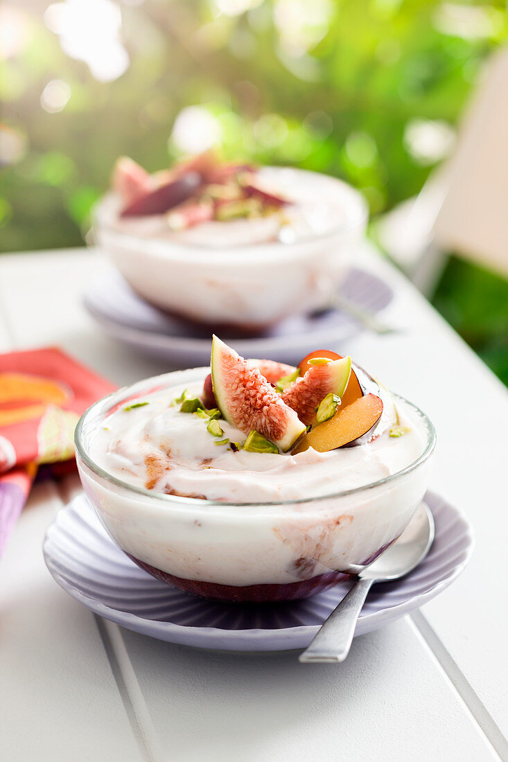 Yoghurt with berry compote, figs and pistachios