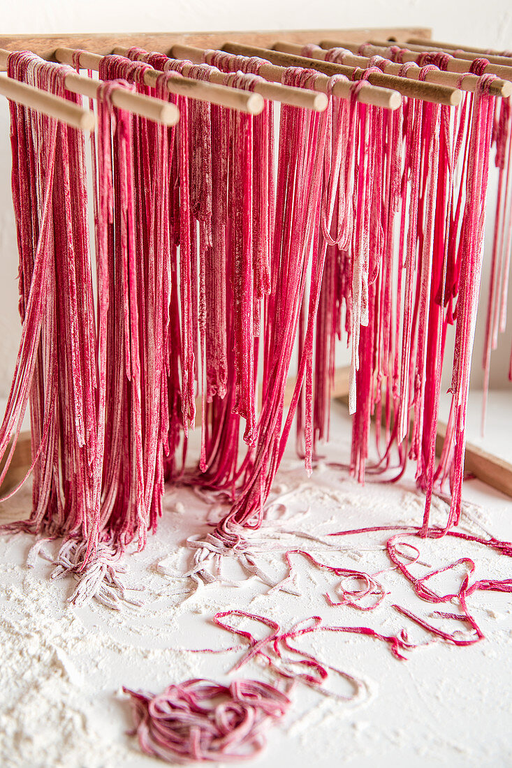 Homemade beetroot pasta drying