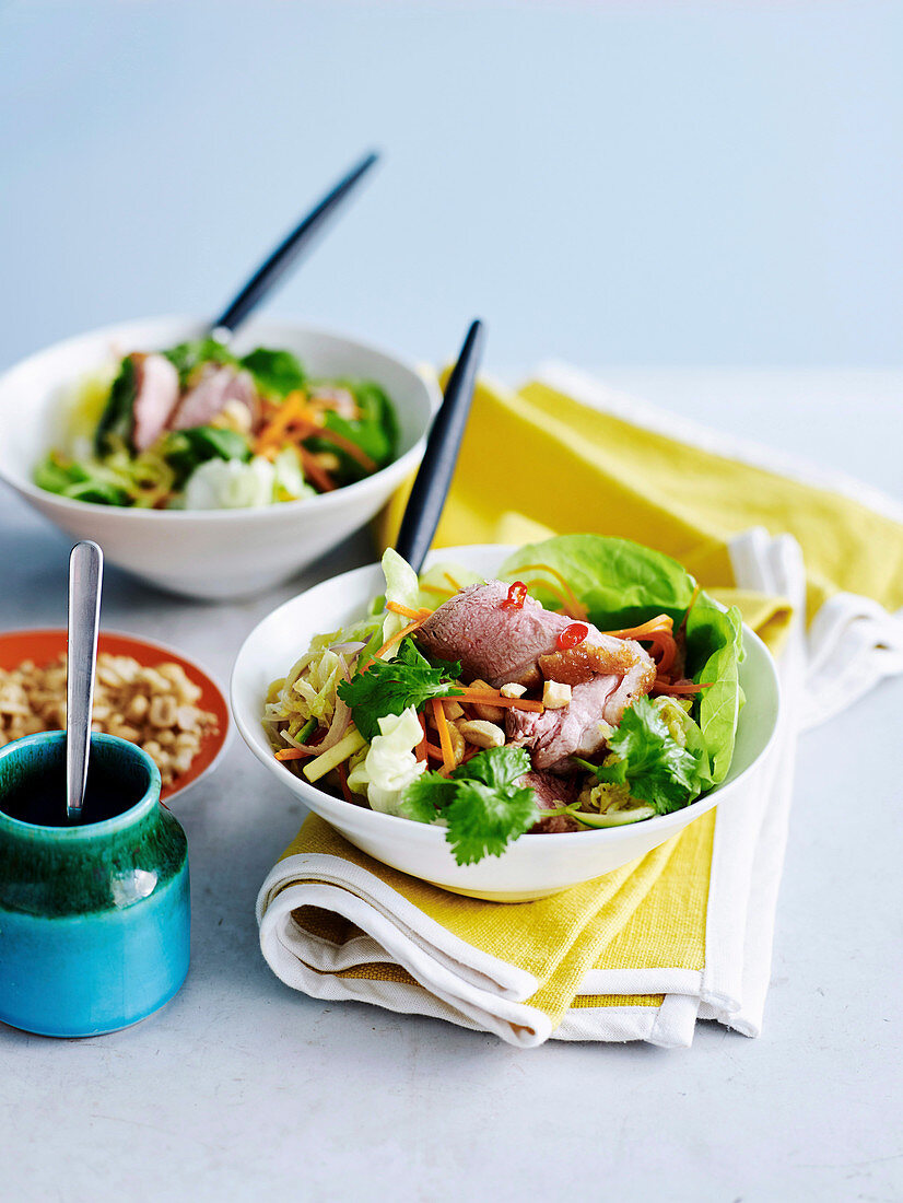 Warm duck salad Thai style in two small bowls