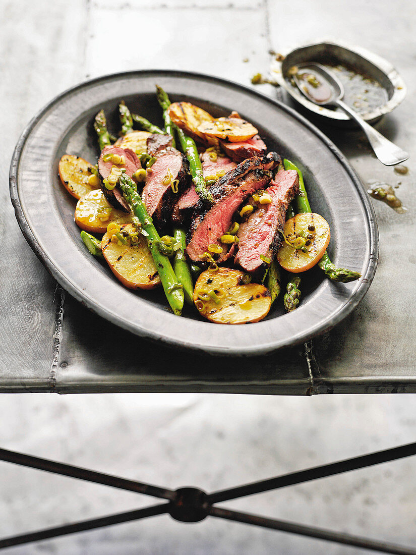 Barbecued butterflied lamb with mint and green onion dressing
