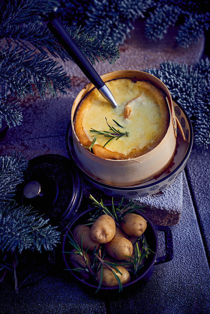 Winter cheese fondue with Mont d'Or and rosemary potatoes