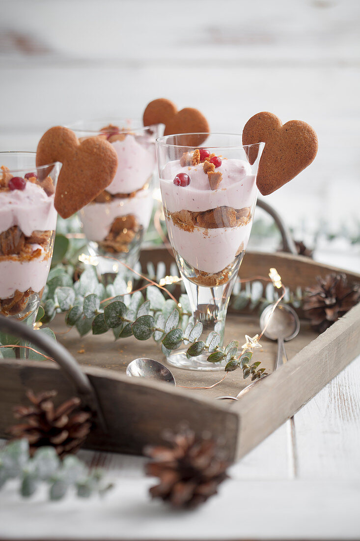 Trifle with crushed gingerbread cookies and lingonberry cream