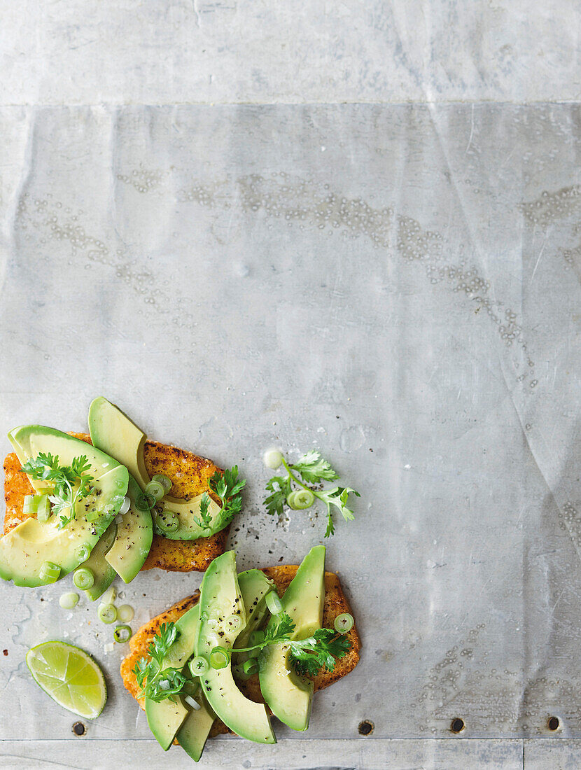 Cornbread toasts with avocado and lime