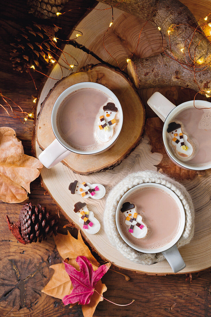 Melting marshmallow snowmen in hot chocolate