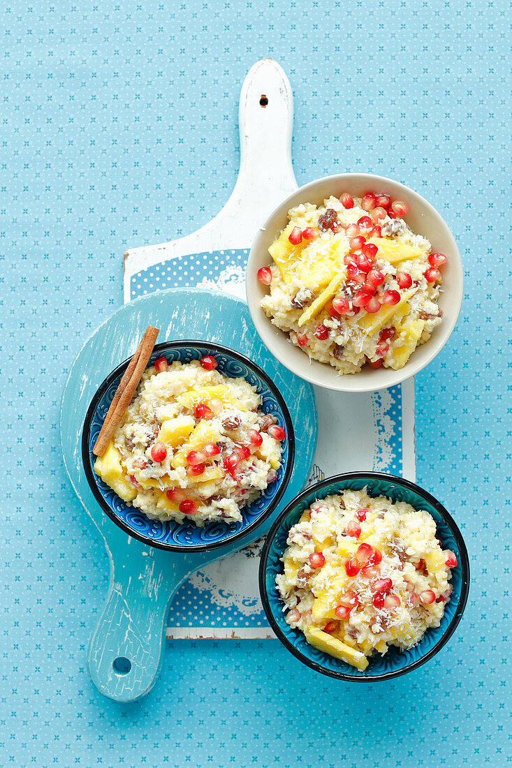 Millet coconut pudding with pineapple and pomegranate