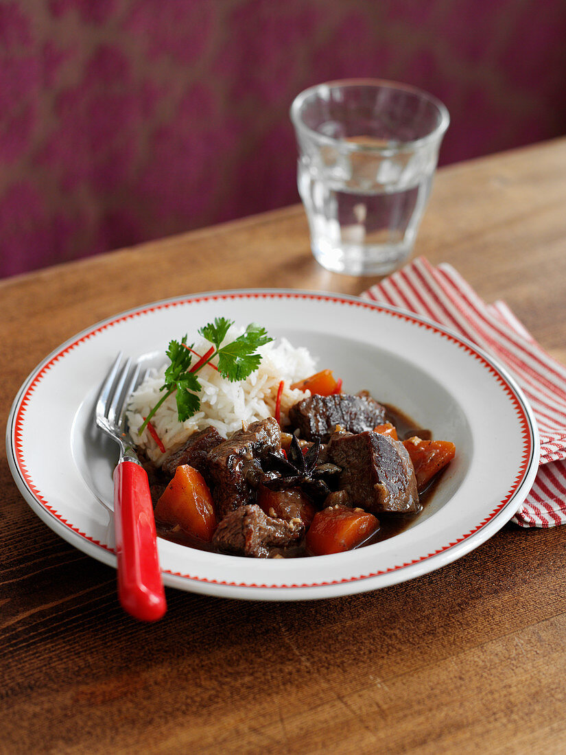 Braised beef with carrots and rice
