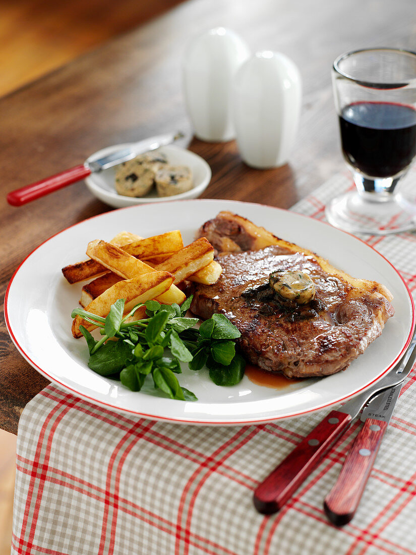 Sirloin steak with herb butter and french fries