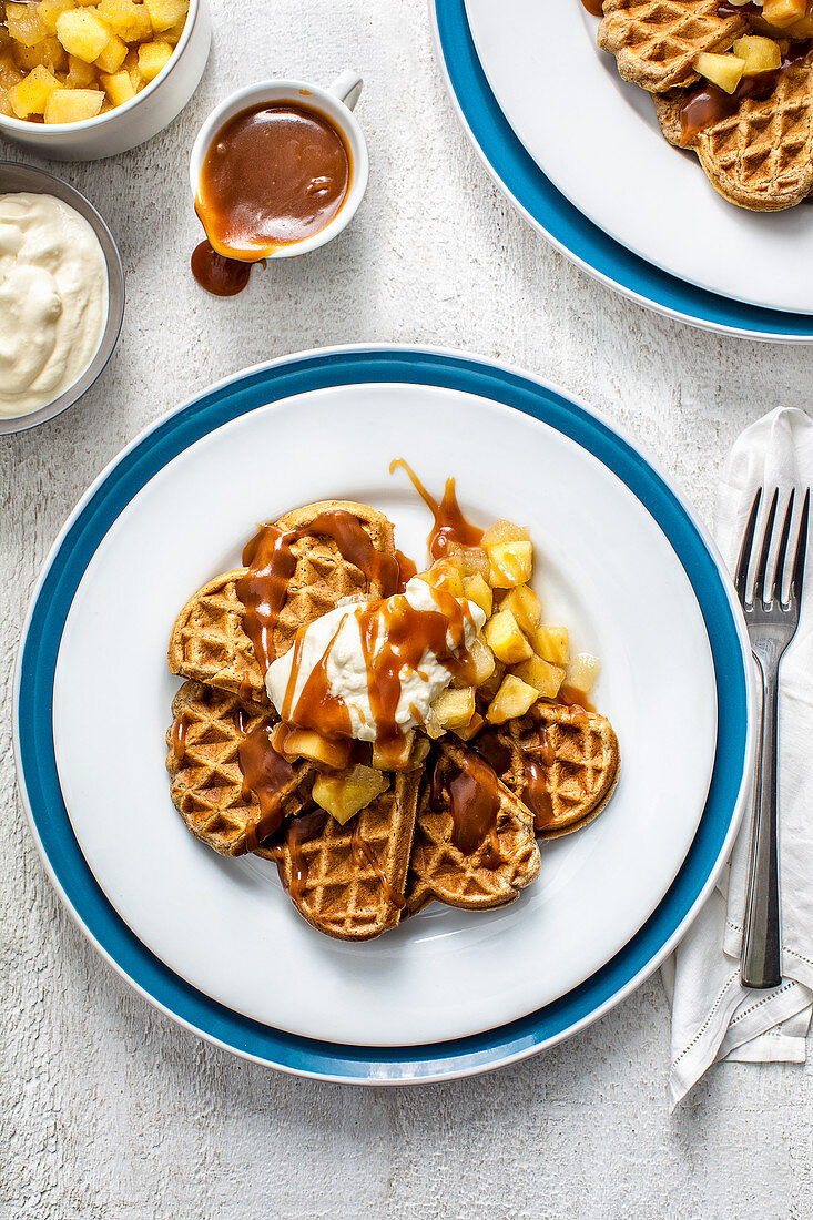 Maple syrup waffles with poached apples and bourbon caramel sauce