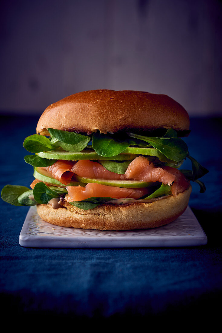A smoked salmon, apple and lambs lettuce burger