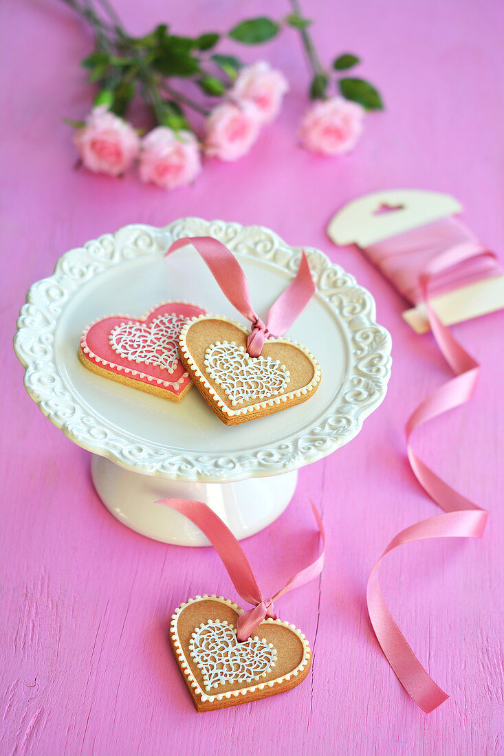 Colourful heart-shaped biscuits on a cake stand