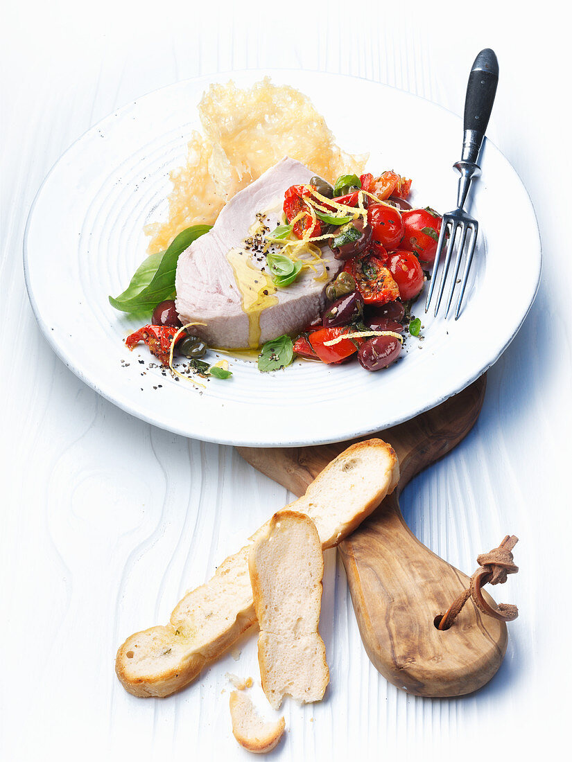 Swordfish with olives, capers and tomatoes