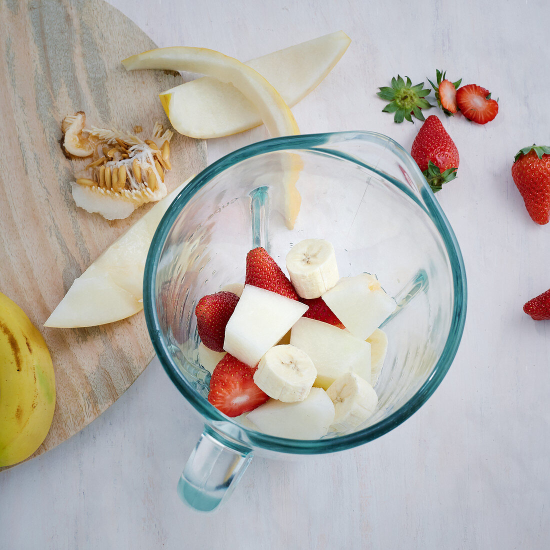 Strawberries, melons and bananas in a blender for making purée