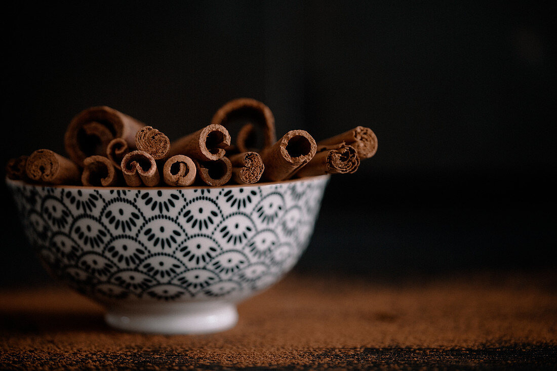 A bowl of cinnamon sticks