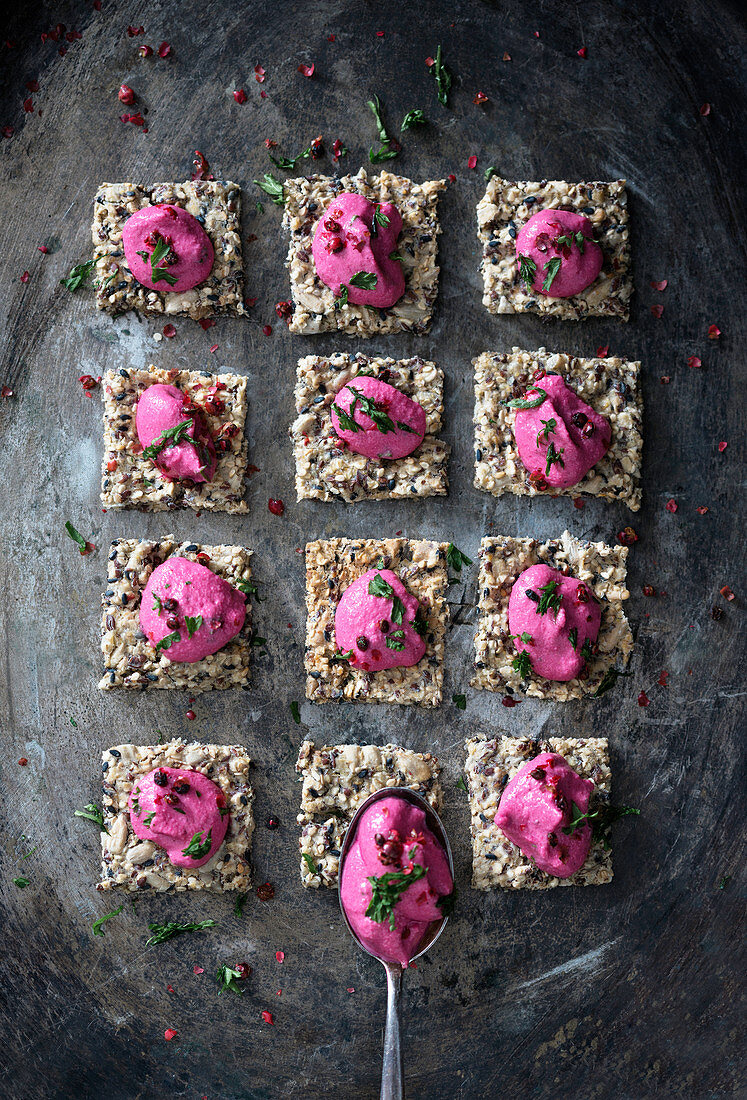 Wholemeal crackers with a vegan beetroot and cashew nut spread