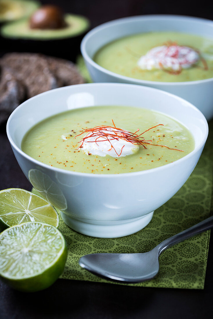 Vegan cream of avocado soup with limes and chillis