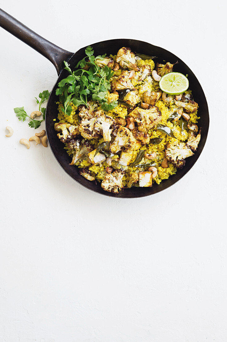 Spicy millet pilau with roasted cauliflower and paneer cheese