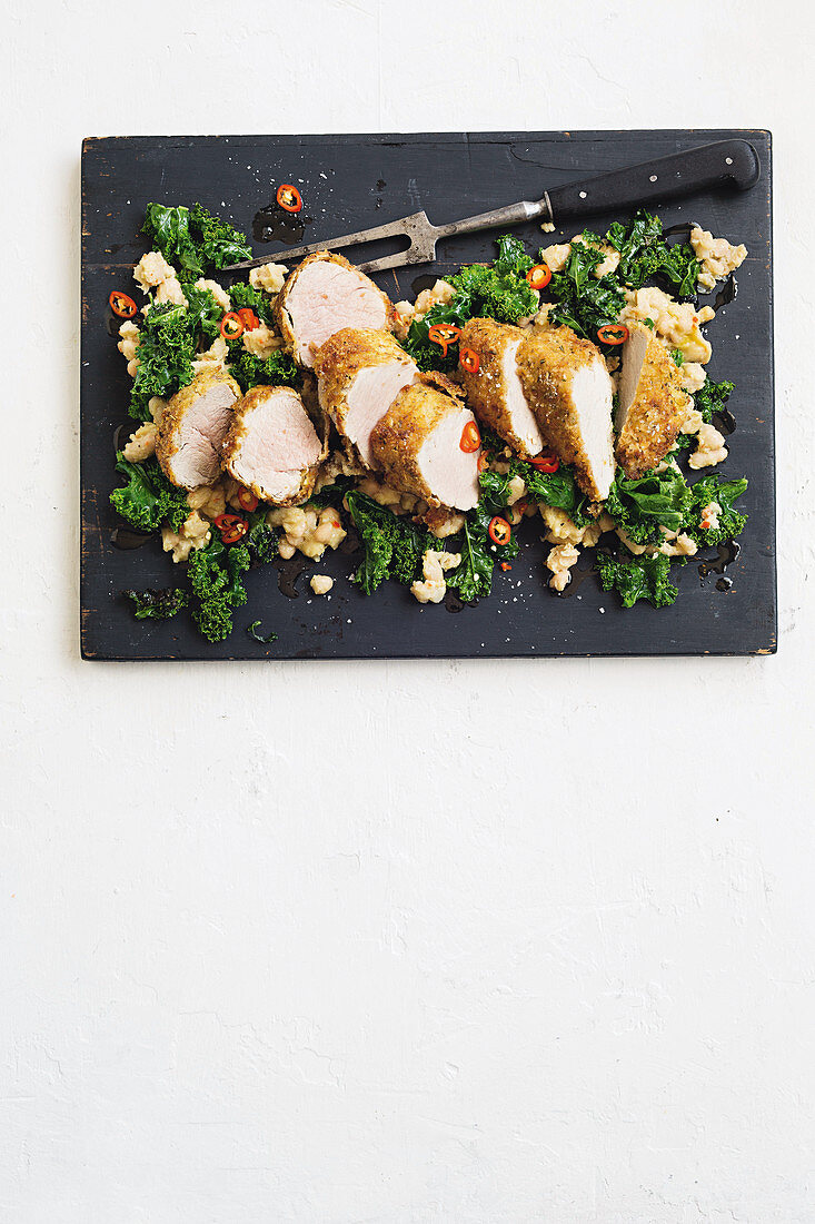 Breaded pork with kale, lemons and cannellini