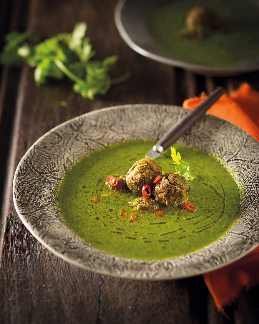 Spinach soup with spicy lentil balls