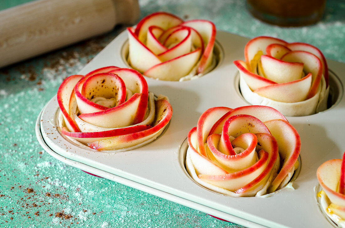 Apple roses in puff pastry in a muffin tin (unbaked)