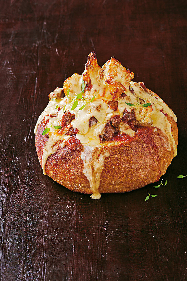 Bread filled with beef, bacon and cheese