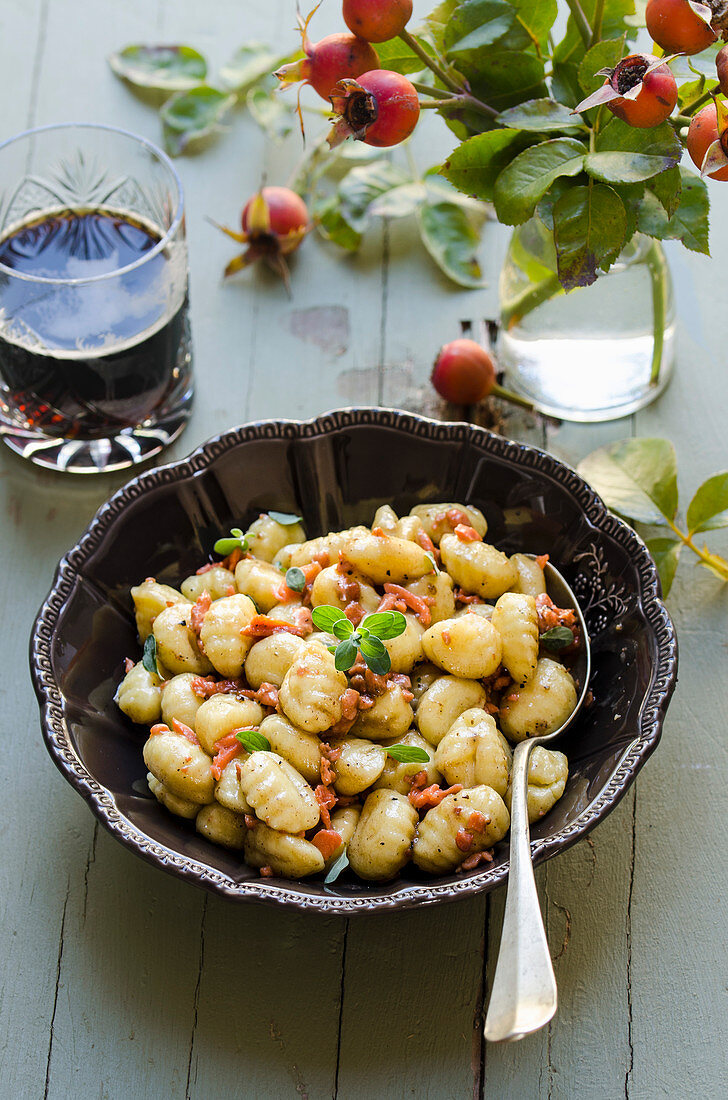 Potato gnocchi with salmon, butter and dark beer sauce