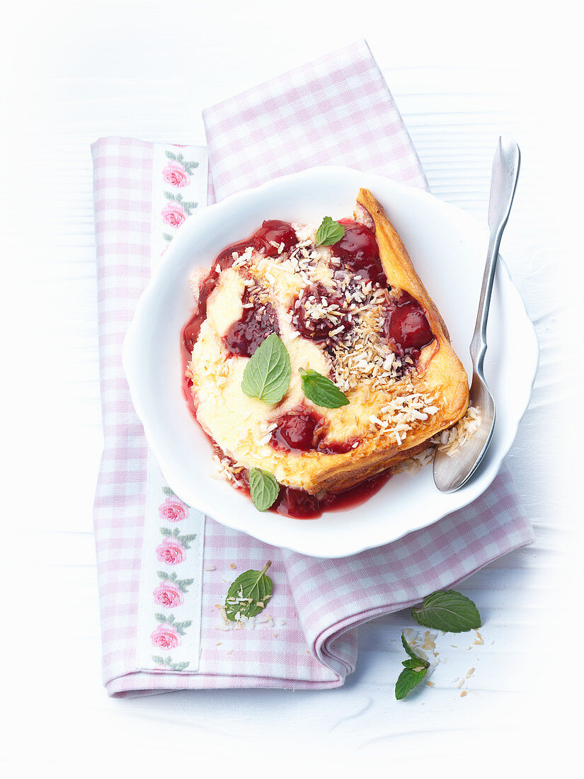 Quark and cherry casserole with grated coconut