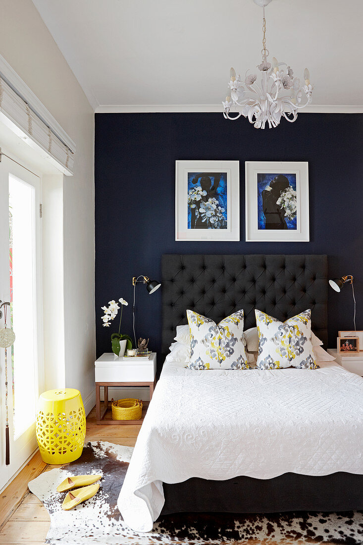 Dark blue wall in elegant bedroom