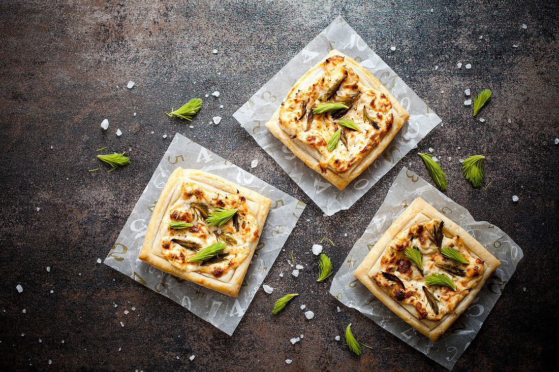 Savory pies with salmon, lemon and spruce tips