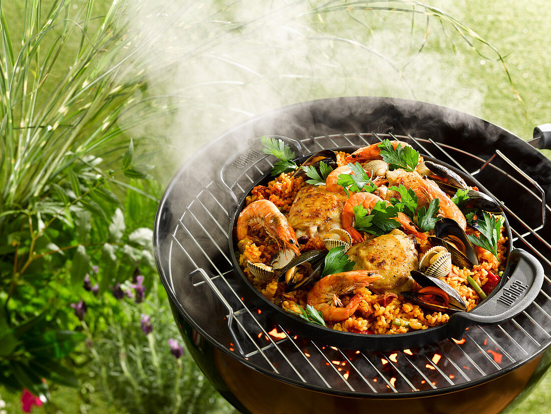 Grilled paella with chicken and seafood