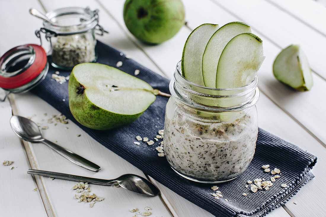Muesli with pear slices in a glass jar