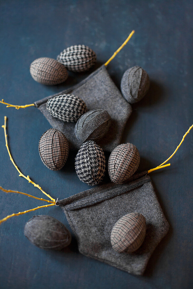 Easter eggs wrapped in fabric and small, hand-sewn bags
