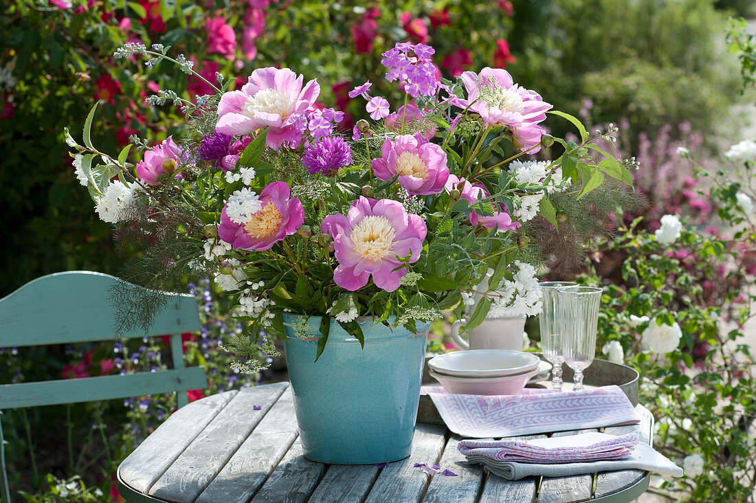 Paeonia 'Bowl of Beauty' (peonies), branches of Deutzia magnifica