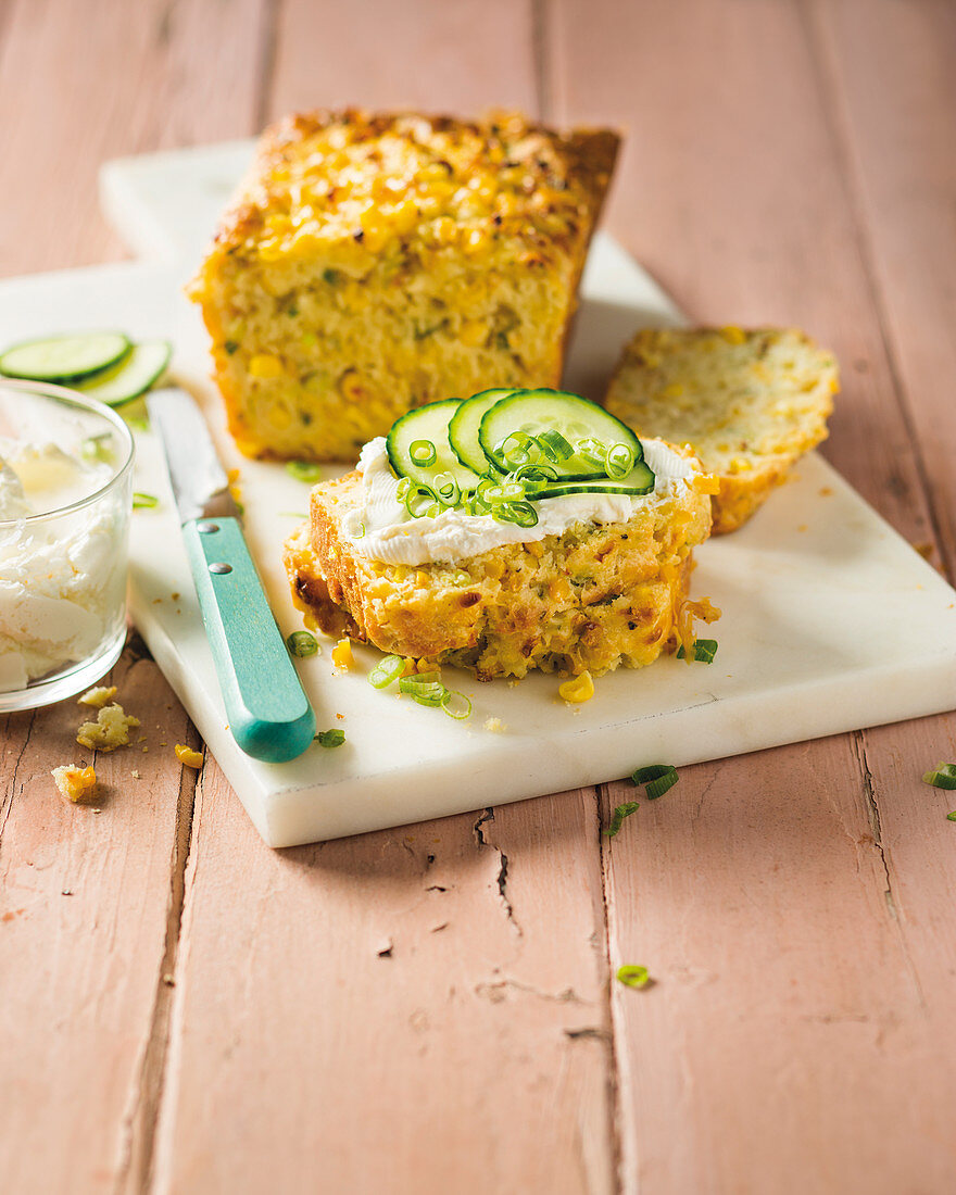 Cornbread with butter and cucumber slices