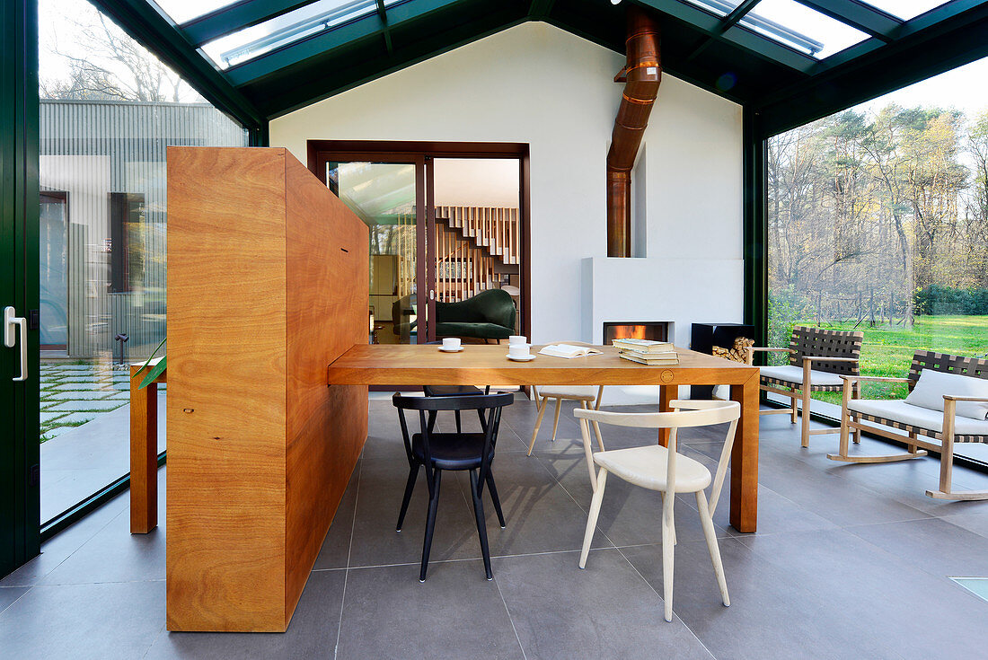 Dining table and chairs in modern conservatory