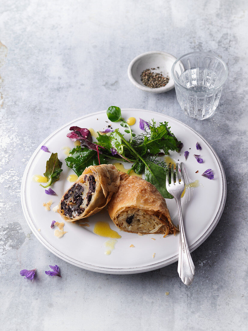 Herb salad with black pudding and cabbage strudel