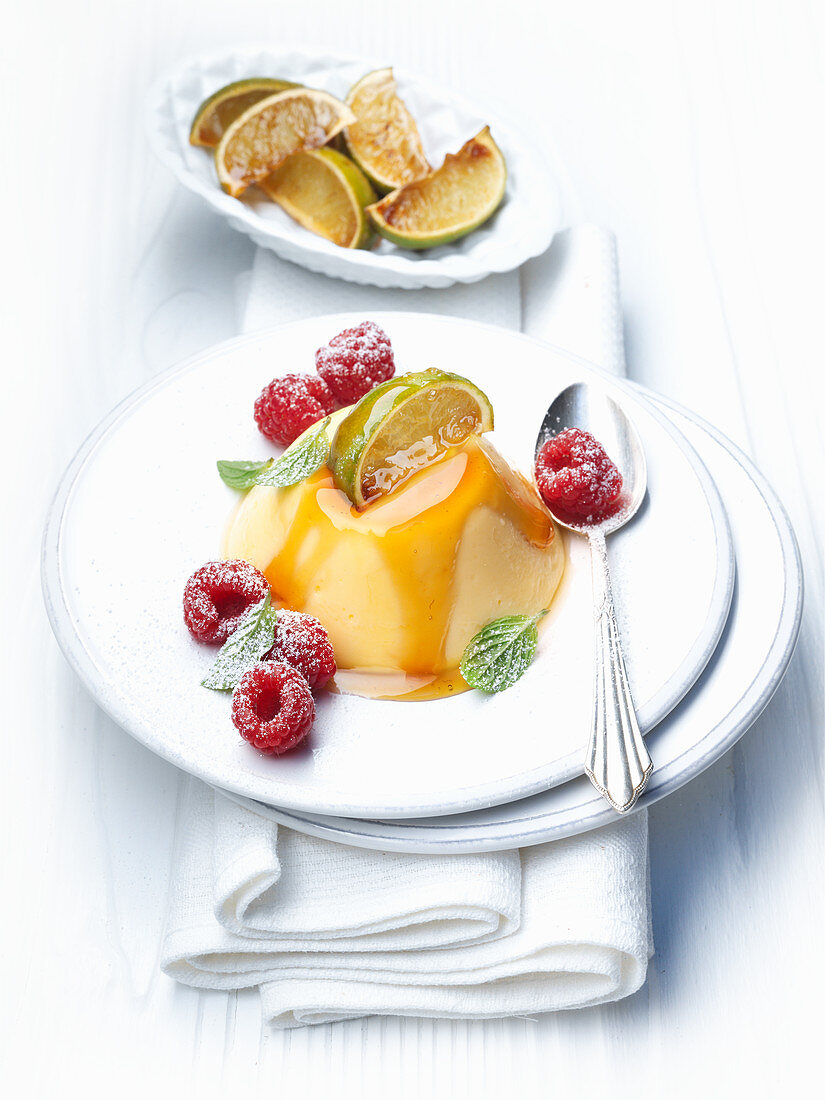 Creme caramel with ginger, limes and raspberries