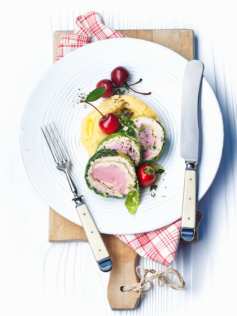 Duck breast wrapped in savoy cabbage with marzipan cherries