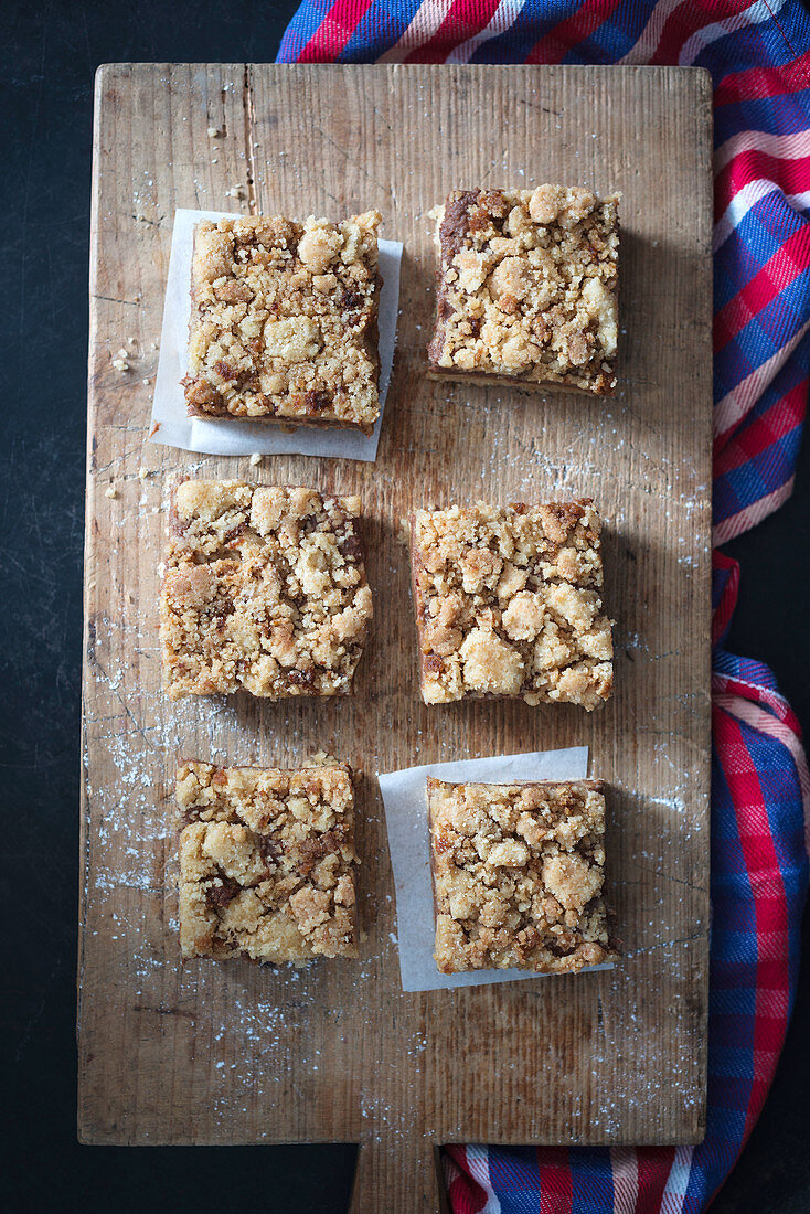 Vegan crumble cake with a mango and chocolate cream filling