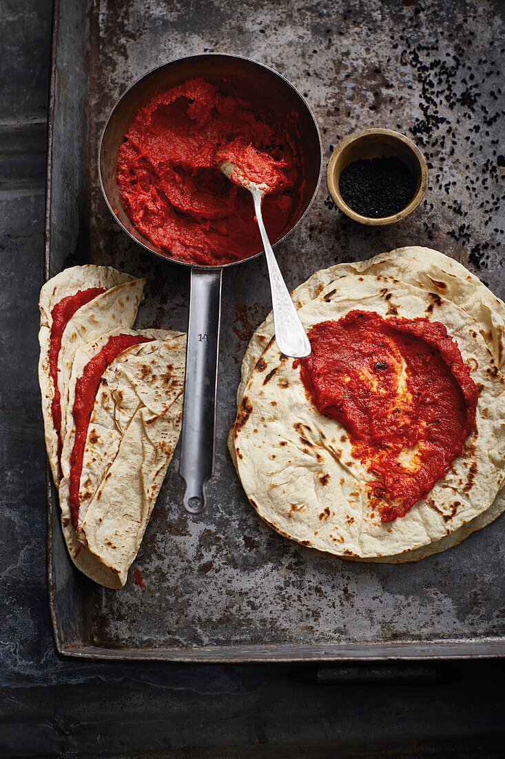 Tortillas stuffed with mhammara (pepper paste, Syria)