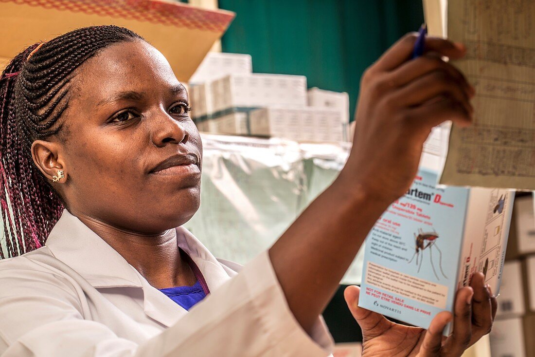 Pharmacist handling malaria drug