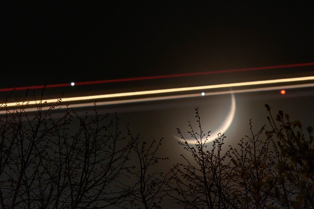Crescent moon and plane