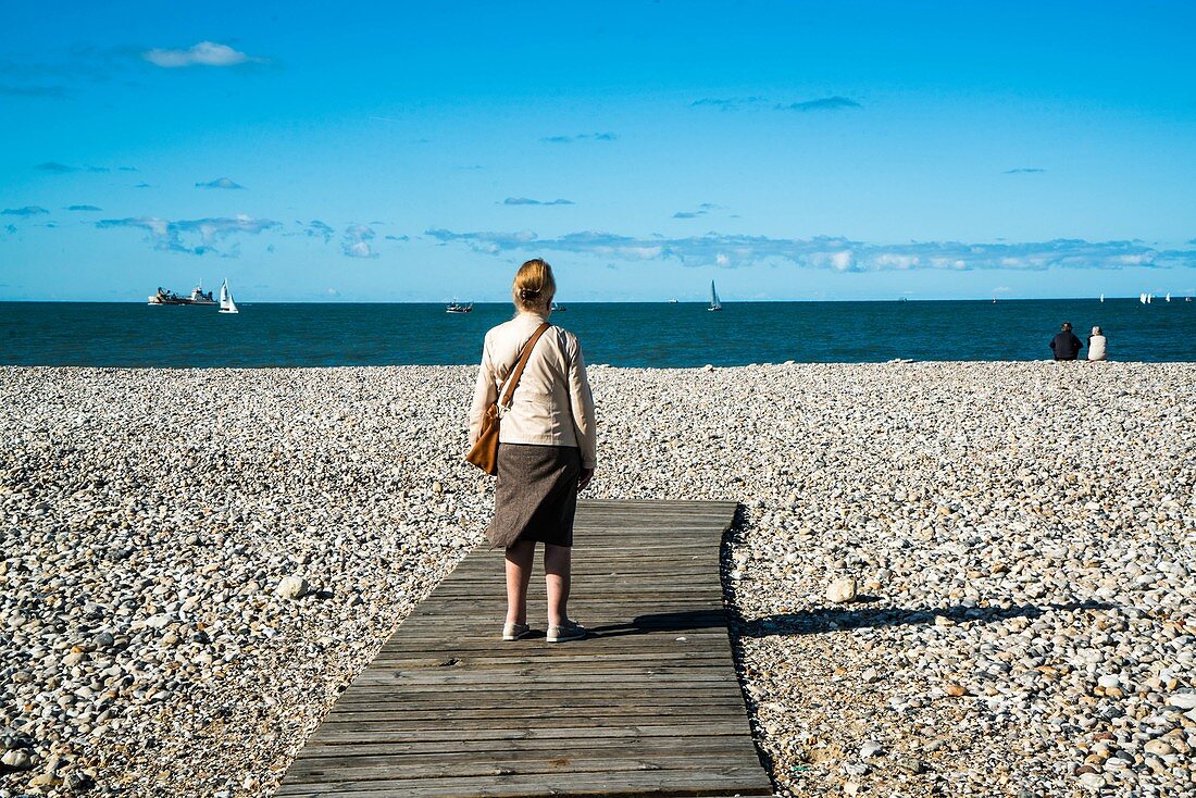 Elderly woman on beach